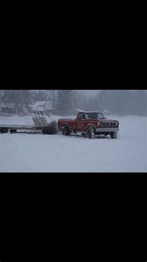 Kevin - JYD on Instagram: "If anyone ever asks, this is my happy place. An 80s ford digging through snow at a vintage snowmobile meet during a snowstorm 🤘"