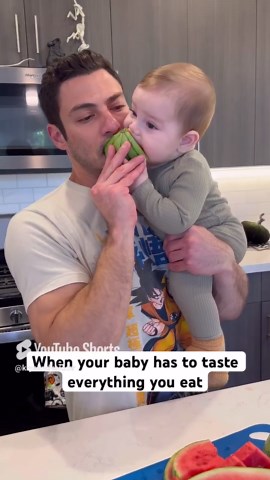 Baby insists on sampling every bite parents take