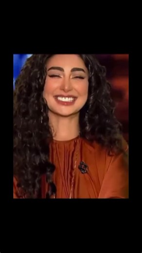 Engaging Studio Presentation with Curly Hair Enthusiast