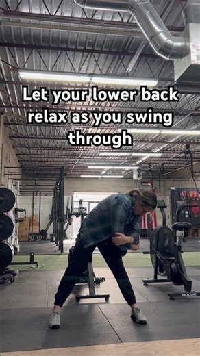 Lower back pendulum swings in a straddle