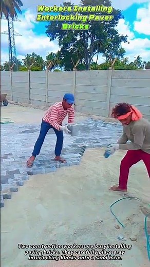 Workers Installing Interlocking Paver Bricks
