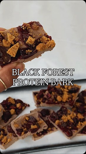 Black Forest Protein Bark🤤 Makes ~12 squares Ingredients: 400g chocolate yoghurt 1/2 cup chocolate protein powder 1 cup cherries, quartered (fresh or frozen) 3 Biscoff biscuits, crushed Instructions: 1. Stir the chocolate yoghurt and protein powder together. 2. Line a small baking tray with baking paper. Spread the yoghurt mixture into an even layer. 3. Scatter the cherries evenly over the top, then sprinkle the crushed Biscoff over everything. 4. Freeze for 2–3 hours, or until firm. 5. Snap or