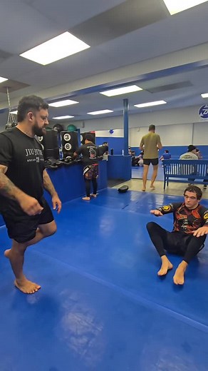 This is a drill we started using in our warm-ups to get the blood flowing and the cardio firing right away. The person on bottom is not allowed to reverse or connect to their partner. No closed guard and no half guard. You must keep your guard open and keep moving. Keep your hips active, keep your feet live, and focus on constant movement to prevent the guard pass. The person on top has their own restrictions. They cannot drop to their knees to pass. They have to stay on their feet the entire ti