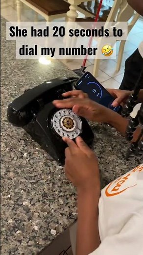 My daughter trying to use a rotary phone ☎️ or an old fashioned phone 📞 as they called it #genalpha