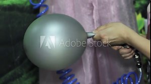 Working process of inflating a balloon with gas helium from a metal gas cylinder