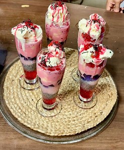 "BEAT THE HEAT WITH ROSE'S KITCHEN! Our Special Royal Falooda video is out now! Watch and indulge in this exclusive summer dessert! Contact us at 9437141055 to make your order! #RosysKitchen #Faluda #SummerVibes" | Rosys Kitchen