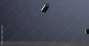 SUPER SLOW MOTION Empty pistol shells falling on a ground against blue background. Shot with high speed camera at 720 FPS