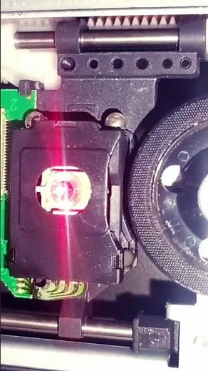 Cleaning a DVD lens
