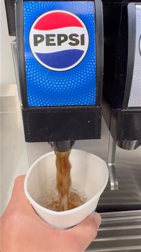 getting Pepsi soda drink refill at Sam’s Club soda fountain machine