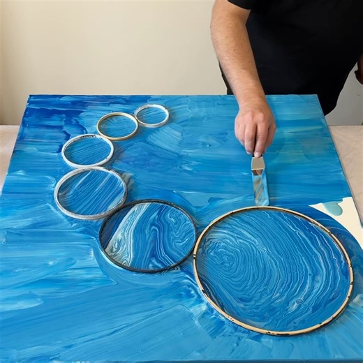9.4K views · 335 reactions | A massive fluid art creation using six embroidery hoops to create a 3D effect! Multiple pouring techniques too! You won’t want to miss this one  | Mark J Ratcliffe Art | Facebook