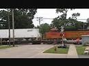 BNSF Train Rolling Past Grade Crossing Signals