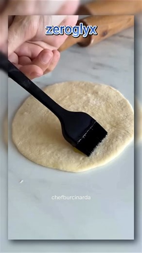 Dynamite Sandwich 🌶️🧨 This spicy and flavorful Dynamite Sandwich is made with soft homemade buns and a fiery chicken filling that truly lives up to its name. For the Dough: Mix 600 g flour, warm water, warm milk, powdered yeast, and sugar in a bowl. Let it sit 5 minutes, then add the egg, oil, salt, and softened butter. Knead until you get a smooth, soft dough. Cover and let it rise. Divide into 14 pieces, shape into balls, rest again, then roll each lightly into 15×13 cm ovals using a little 