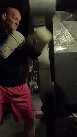 Boxing workout getting the shoulder stronger with a good workout in basement gym