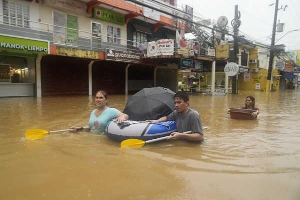 Storm sets off floods and landslides in Philippines, leaving at least 14 dead