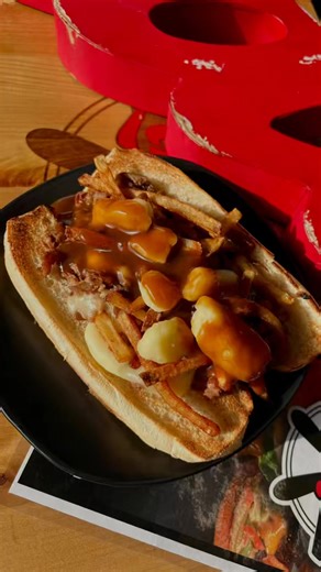 Watch the Pit Boss Poutine Sub come to life 🔥 From our slow-smoked beef to the melty white cheddar cheese curds, fresh-cut fries and that rich au jus gravy poured right over top… this one is pure comfort food in the making. Warning: you might need one after watching this 🤤 | Lizzy's Restaurant