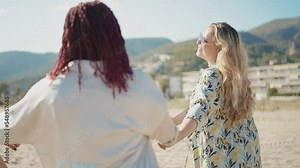 Cinematic storytelling footage of beautiful plus size women having fun at the beach in the summertime. Oversized big girls friends, representation of body positivity and body acceptance concepts