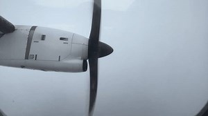clip-1103158729-rotating-propeller-airplane-flying-through-clouds