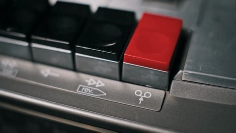 clip-3965131587-detailed-macro-shot-finger-pressing-red-rectangular