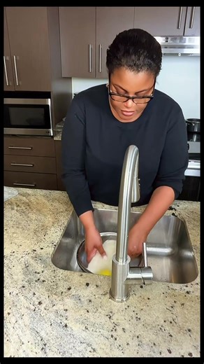 Washing salted cod fish in lemon and vinegar water