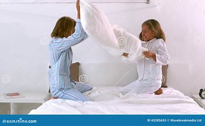 Siblings Having a Pillow Fight on the Bed Stock Video - Video of pajamas, duvet: 43285655