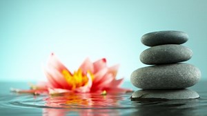 Super slow motion of dripping drops into water, spa and wellness concept. Filmed on high speed cinema camera, 1000 fps.