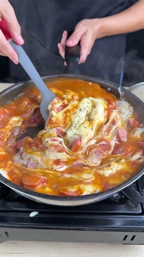 Creamy hot dog with cheese and shoestring potatoes