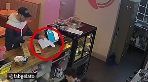 Shocking moment thief steals phone using piece of paper