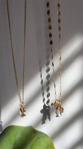 Have you seen our newest Charm Bar chains? They are thinner and daintier so charms just slide on. Love this option for showing off your favorite charms! 🔗🤍✨ | Red Giraffe Designs