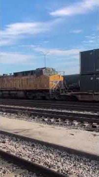 UP stack train with UP 1995 going through T&P station