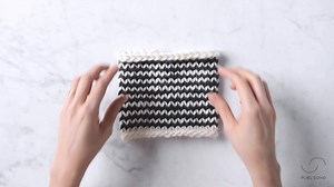 You knit our Garter Ridge Cowl in rounds of knits and purls, first in...