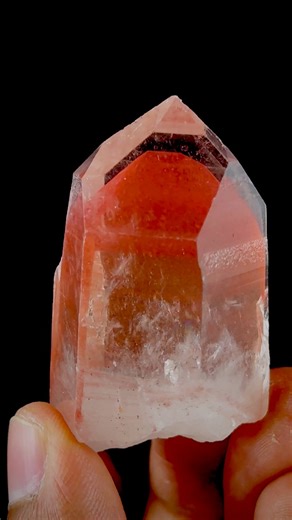 On The Way 🛫 Quarry Fresh Find of Red Hematite Phantom Quartz from Telangana, India. Ever wondered how does phantoms form in a quartz crystal? Quartz crystals grow slowly from mineral-rich solutions over long periods. Sometimes, the growth of a quartz crystal pauses because of a change, maybe the temperature drops or different impurities enter the solution. During this pause, a thin layer of dust, clay, chlorite, hematite, or other minerals might settle onto the crystal surface. When growth res