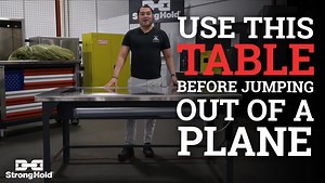Strong Hold Human Resources Director, Mike Bandy, introduces a new parachute inspection table that will be used by Parachute Riggers to check for any tears, holes, and inconsistencies in the canopy. Mike is a Retired Special Forces Officer and Jumpmaster, so he knows his parachutes and all the work that goes into ensuring their safety. #parachute #manufacturing #custom #steel #madeintheUSA | Strong Hold Products