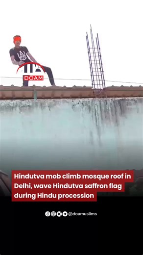 During a Hindu procession, Hindutva mob climbed on the wall of a mosque in Delhi, hoisted a saffron flag, and danced while waving maces. #India