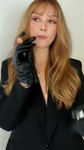 babe in gloves with a cigar