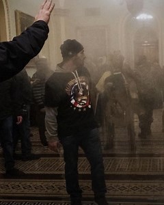 FBI searches for man seen beating police during Capitol riot