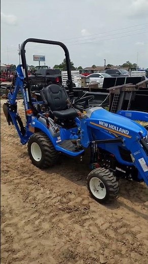 Unleash Versatility and Power with the New Holland WM25s with Backhoe | Get the Job Done Right!