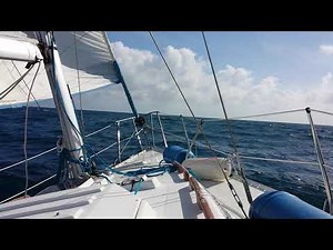 Sailing Hunter 28.5 sailboat upwind into ocean chop
