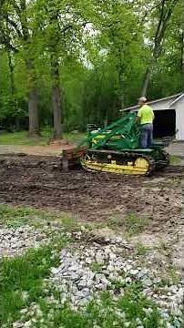 JD 420 crawler doing work around sawmill