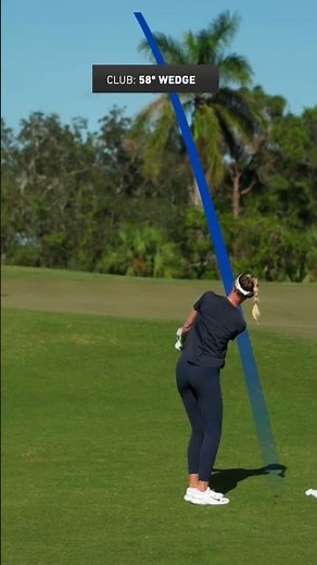 Tiger Woods hits the pin showing Nelly Korda his draw chip...