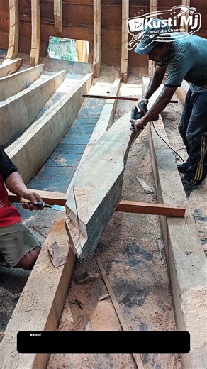 Mastering Precision Timber Shaping: Handcrafted Beam Cutting Inside a Traditional Wooden Structure.