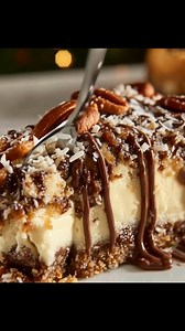 German Chocolate Cheesecake Ingredients: - 1 1/2 cups graham cracker crumbs - 1/4 cup sugar - 1/3 cup unsalted butter, melted - 3 (8 oz) packages cream cheese, softened - 1 cup sugar - 3 large eggs - 1 teaspoon vanilla extract - 1/2 cup sour cream - 1/2 cup heavy whipping cream - 1 cup shredded coconut - 1 cup chopped pecans - 1/2 cup evaporated milk - 1/2 cup brown sugar - 3 tablespoons unsalted butter Directions: 1. Preheat your oven to 325°F (163°C). In a medium bowl, combine graham cracker c