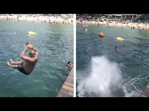 Man Throws Ball In Air While Diving