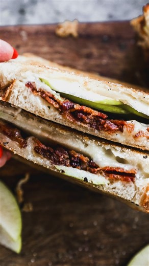 Crispy Jones Dry-Aged Bacon paired with creamy fontina cheese with a few apple slices for crunch and a sweet contrast. All sandwiched between some sourdough for a melty and distinctively delicious sammie. Try it, let us know how you like it. | Jones Dairy Farm
