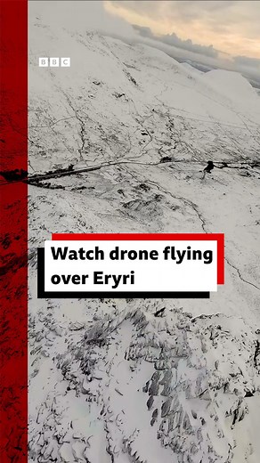 Ever wondered what it's like to fly over a snowy mountain in Eryri? Look no further, this drone footage is pretty magical For more: https://bbc.in/3C40Bgp | BBC Wales News
