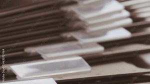 close-up cardboard folders, slider movement through archive documents, file cabinet HR department, family tree, organize financial documents, organization's activities, finances, projects, and events