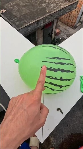 Experiment: Dropping colorful emoji water balloons from a height