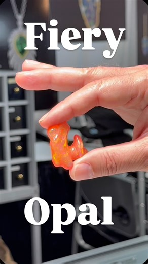🔥 Stopped by National Treasures at the JOGS Show and saw designer Eddie showing this incredible cut Mexican fire opal. The color flashes like it’s lit from within one of the most stunning stones I’ve seen this year. #MexicanFireOpal #NationalTreasures #JOGS #TucsonGems #GemShow | JOGS Tucson Gem and Jewelry Show