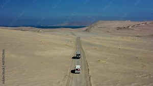 Overlanders Driving Sand Track Paracas National Reserve Expedition Truck Van Blue Sky Pacific Ocean Dune