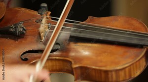 Young woman playing classical compositions on a violin