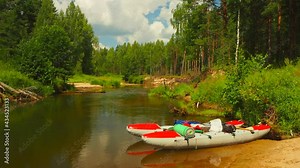 Rafting on the forest river on beautiful sunny summer days. Unique natural locations far from civilization. Vacation on the forest river.